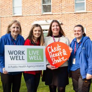 Rebecca Hawkins Workplace Health and Wellbeing Co ordinator at Northern Ireland Chest Heart Stroke and Ashley Bolton Employment Officer at Stepping Stones NI with Stepping Stones NI staff